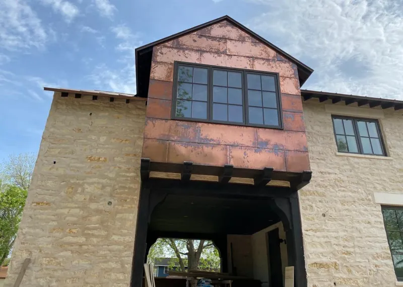 Copper metal panel facade on a stone building for Roof Repair in Nanakuli
