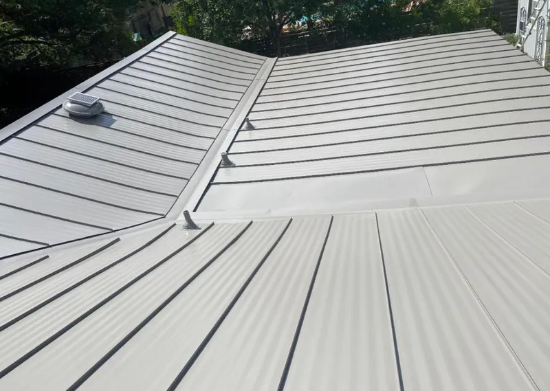 Solar attic fan installed on a metal roof for Roof Ventilation in Nanakuli